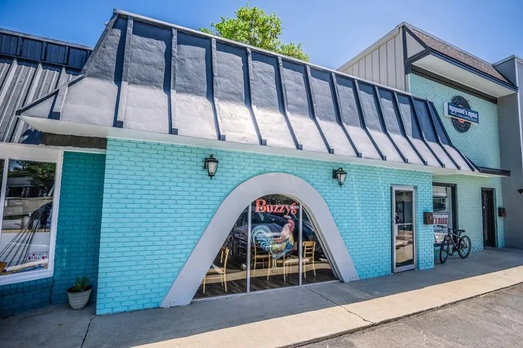 Buzzy's Midtown, a bright blue brick building on Thorne Avenue