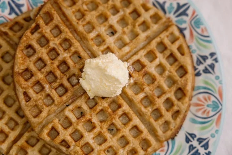 Buttermilk waffle topped with butter